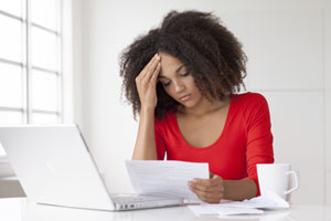 Stressed woman reviewing documents