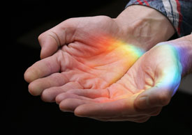 Hands and rainbow