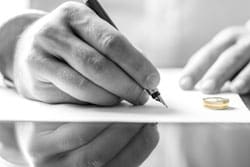 Wedding ring and divorce papers