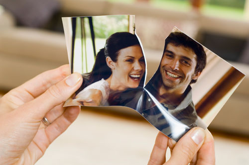 Torn photo of married couple